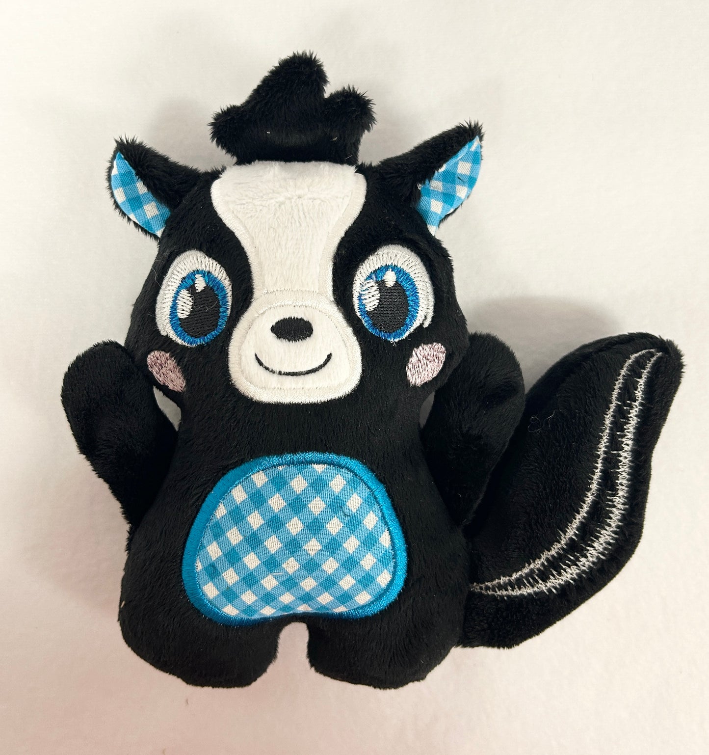 Medium Huggable Skunk Stuffie